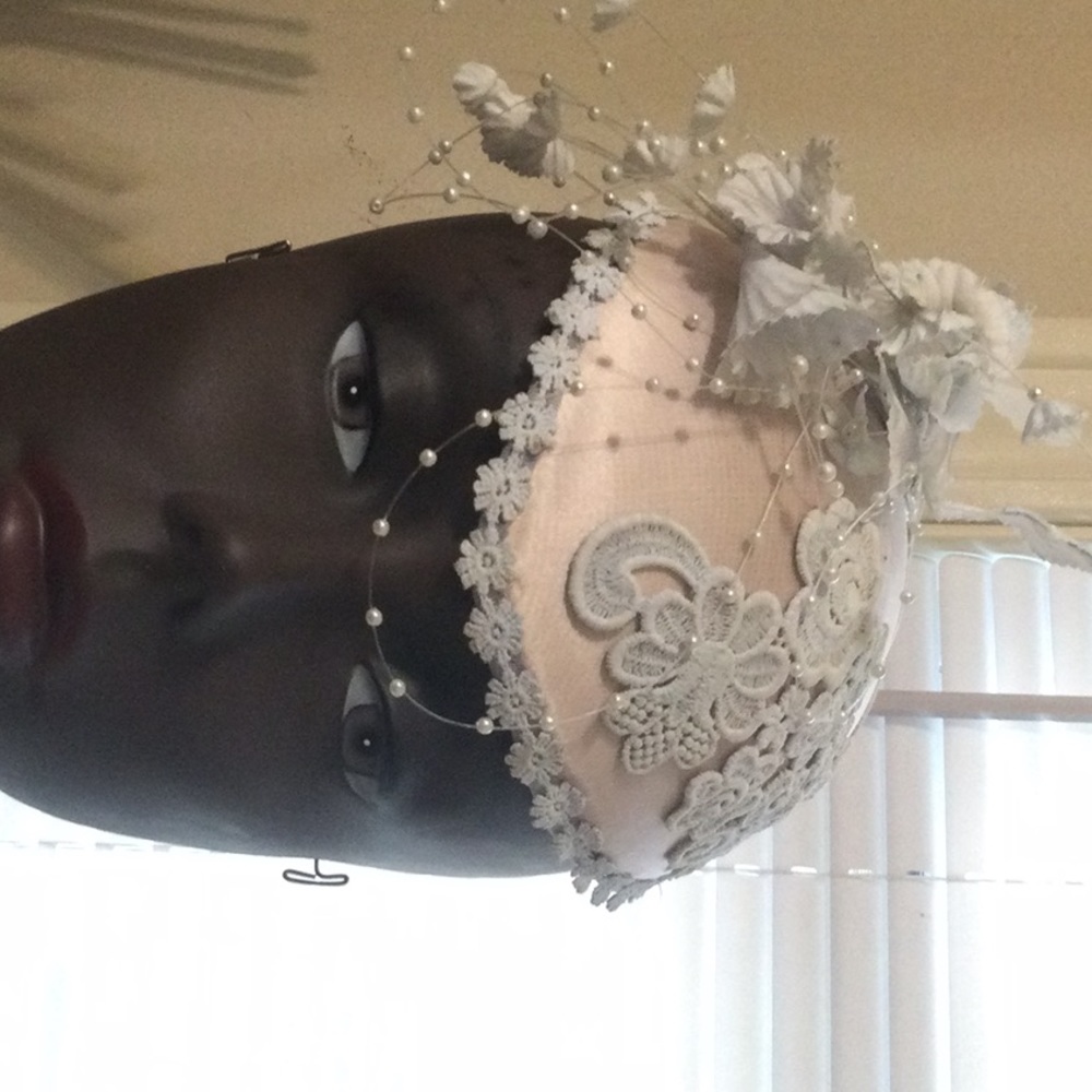 Vintage Cream-flesh tone fascinator with pearl and lace detail.